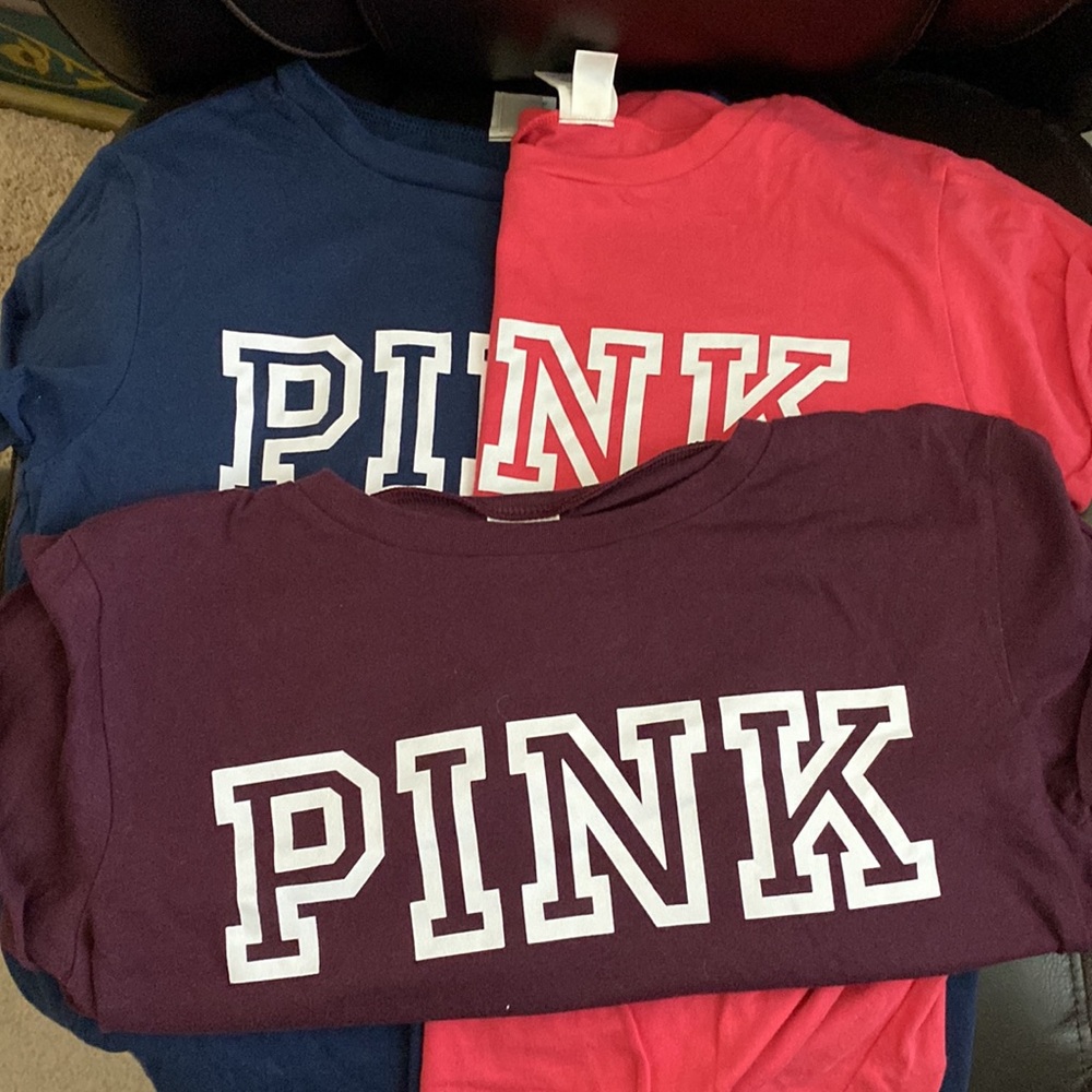 Three Victoria Secret Pink t-shirts.